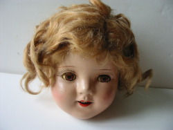 hazedolly: Vintage Shirley Temple lookalike doll head with tin eyes.  Photo credit: Unknown eBay seller 