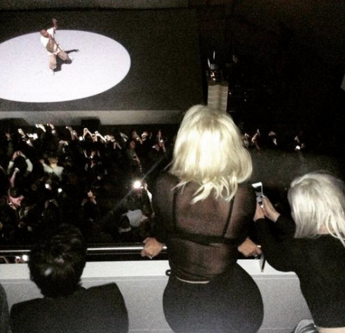 kuwkimye:Kim watching Kanye perform at the Foundation Louis Vuitton in Paris - March 7, 2015