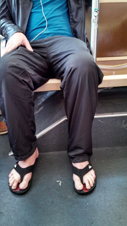 Transit porn. Those big feet caught my eye at first, but then I was captivated by the big white stain of dried cum on his shirt near the waistline. He busted me with a big grin. Ah, the simple pleasures of life in the big city.