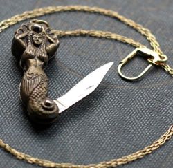 fuckyeahpaganism:  I NEED THIS EVERYONE  Mermaid Pocket Knife Necklace by  contrary on etsy
