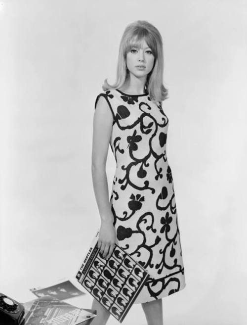 Pattie Boyd in a dress by Brilkie, in her hand the 1964 album A Hard Day’s Night by The Beatle