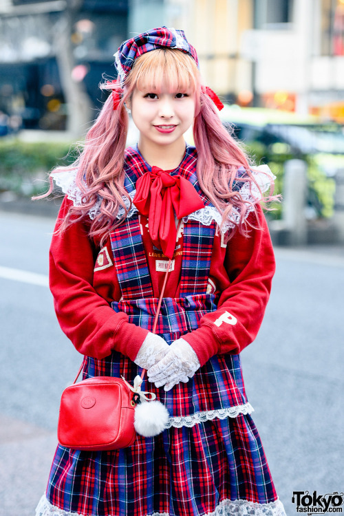 Japanese designer Rio on the street in Harajuku wearing a sweatshirt by Pink House with a handmade p