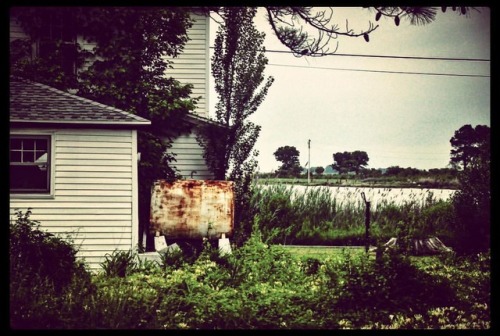 Smith Island landscape with fuel tank.  #landscape #smithisland #colorphoto #smalltownusa #islandlif