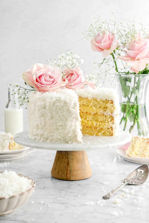 fullcravings:Coconut Cake with Coconut Pastry Cream Filling and Vanilla Buttercream
