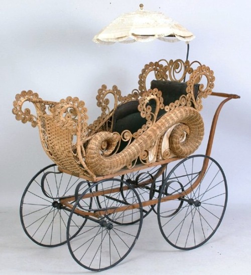 Ornate late Victorian wicker buggy.