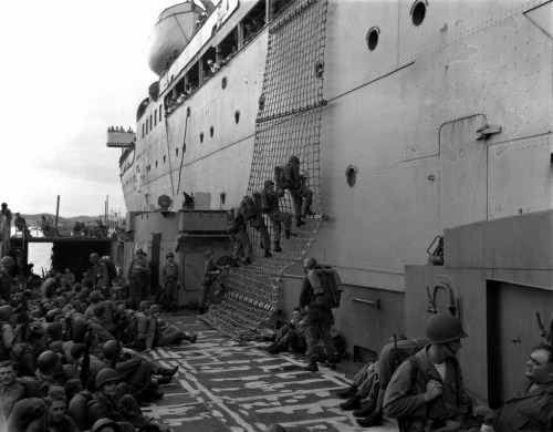 Men of the 1st DAV Div debark from ship to waiting LSU at P'ohang-Dong