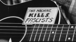 aloofshahbanou: Pete Seeger: “Hitler is dead – why do you still have the sign on your guitar?” Woody Guthrie: “Well, this fascism comes along whenever the rich people get the generals to do what they want.”