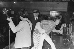 flossie-jones:Mick Jagger is grabbed by a