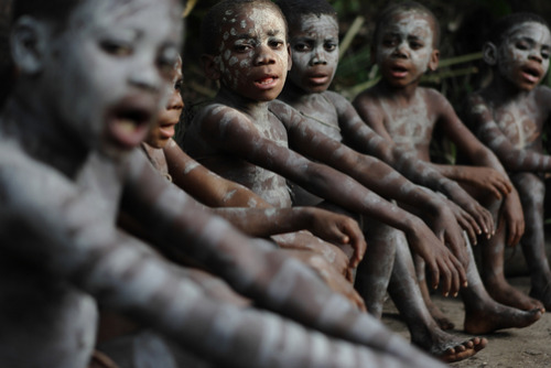 unrar:Mbuti Pygmy boys participating in manhood initiation rites, Congo, Randy Olson.