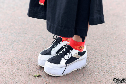 15-year-old Japanese student Nanase on the street in Harajuku wearing a panda themed style with a pa