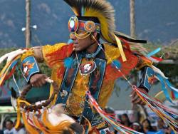 nativeamericannews:  A dancer, clad in bright