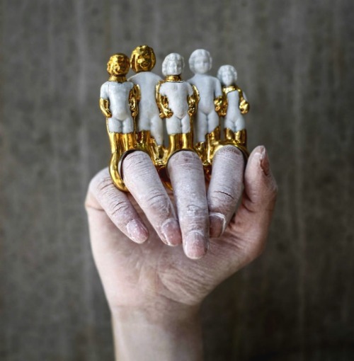 hazedolly:  Art jewellery by Qian Yang: gold-dipped salvaged antique china dolls, doll parts, and figurinesSource: Brown Paper Bag 