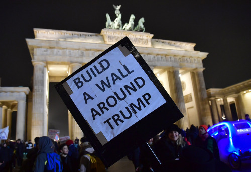 yahoonewsphotos:Protests worldwide against the inauguration of Donald TrumpA banner reading “Build b