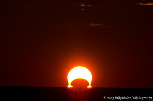kenobi-wan-obi:  An Omega Sunrise Eclipse     The November 3rd sunrise eclipse over the Chesapeake Bay, from Chesapeake Beach in Maryland. These are stills from a time-lapse sequence I shot of the eclipsed sunrise. - Indy 