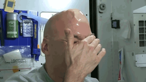aplusappmedia:The water sticks to his scalp like that because of physics: where there is no gravity, surface tension dominates. That means the otherwise weak bonding that happens during surface tension suddenly becomes strong enough for Parmitano’s