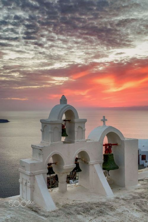 A nice spring sunset in Oia, Santorini, Greece by Vasilis Tsikkinis.