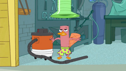 My favorite Lair Entrance from Phineas and Ferb. In the episode “Perry Lays An Egg,” Perry enters his lair through the new Pneumatic Transporter. Unfortunately for him, it has a nasty habit of sucking all the fur off of whoever uses it. 