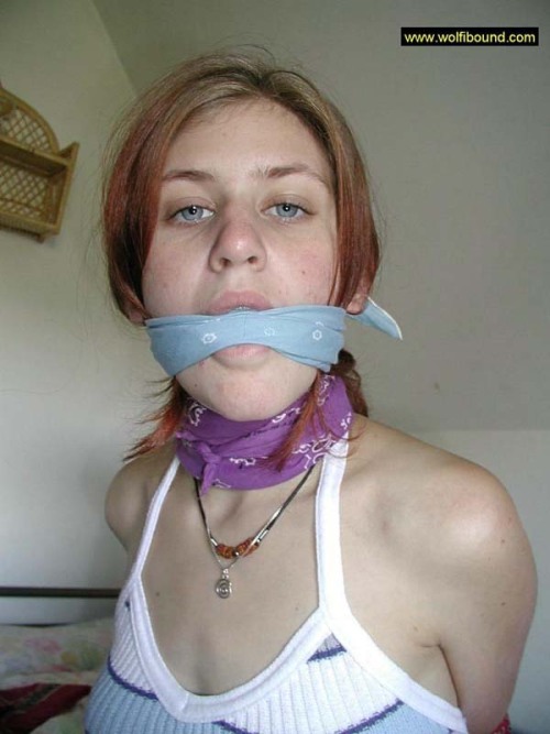 graybandanna:  While she was still bandanna bound and gagged, at least the captor was nice enough to remove the scarf stuffing and the bandanna tied over her mouth