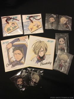 I received a bunch of official YOI merchandise sets today - picked out Otabek and Yuri from each collection to photograph first &lt;3Top left: YOI ema/wooden plaquesTop right: YOI Animate Cafe Series 1Middle left: YOI Character illustration boardsMiddle