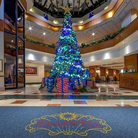 The nautical theming at Disney’s Paradise Pier Hotel features blue, green and silver holiday d