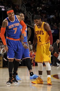gokyrieirving:  Kyrie Irving #2 of the Cleveland Cavaliers shares a laugh with Carmelo Anthony #7 of the New York Knicks during a break in the action at The Quicken Loans Arena on March 4, 2013 in Cleveland, Ohio. 