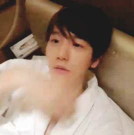 exoturnback:  baekhyun in bed in just a bathrobe… ¬‿¬ 