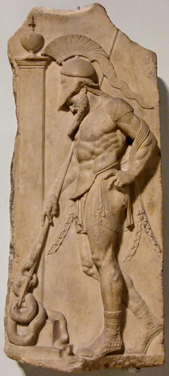 historyarchaeologyartefacts:A fragment of a marble sepulchral relief showing a Greek warrior standin