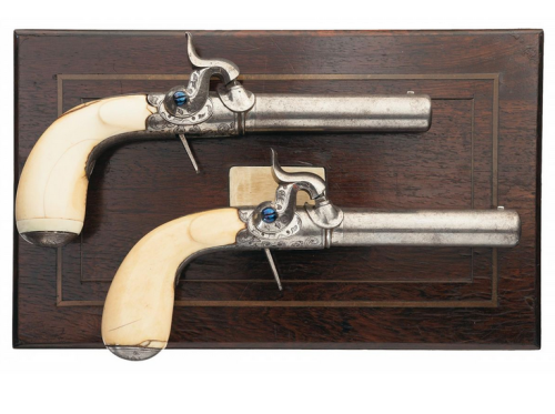 A set of engraved percussion pocket pistols with ivory handles originating from Liege, Belgium, circ