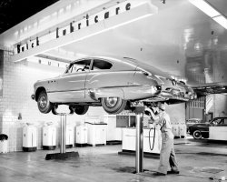 morphene-gimlet:  &ldquo;Put her up on the rack and check her joints, will ya?&rdquo;  1949 Buick, Los Angeles  DWP Archive