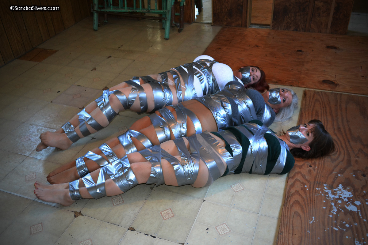 vaultofbondage:  Three little victims taped on the floor, Each one wonders if she’ll