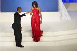 the woman in the red dress :) barack is 1 lucky man thats all