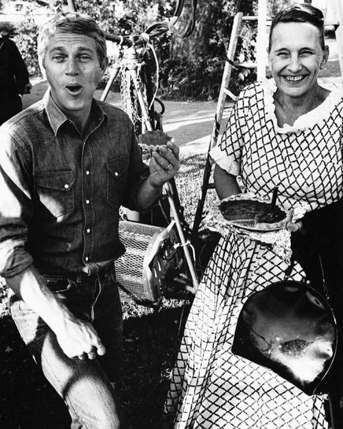 Steve McQueen eating a sweet potato pie brought in by a local woman, on the set of Baby the rain mus