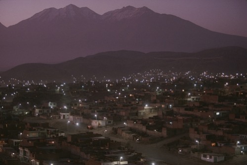 unrar:A view of Arequipa and Misti Volcano at dusk, Peru, William Albert Allard.