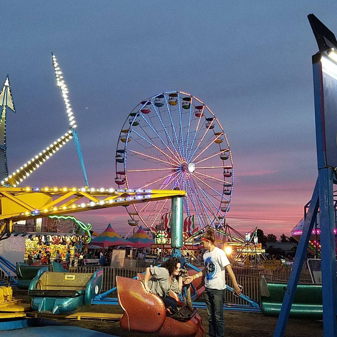 My son and his girlfriend. Love the sunset backdrop when the #fair turns on all the lights. #CSRA (at Georgia-Carolina State Fair)