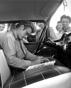 theniftyfifties:  James Dean signing autographs in Texas. Photo by Richard Miller. 