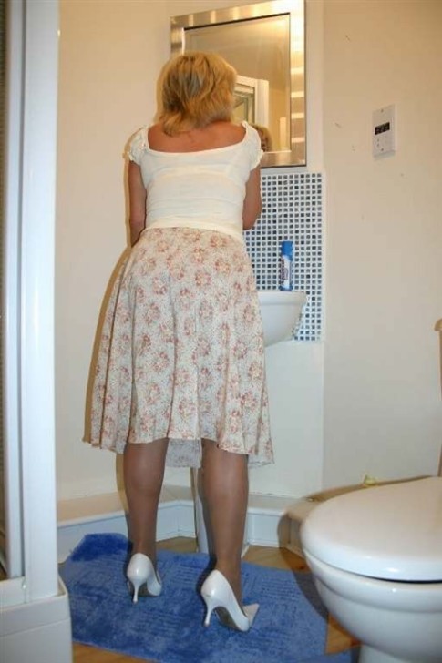 See auntie Brenda in the bathroom doing her makeup and I lifted her skirt and fingered her pussy bef