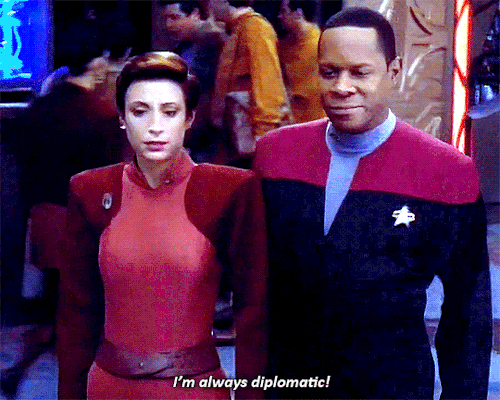 garlandsjudys:[Start ID: 2 gifs of Kira Nerys from Deep Space 9. First gif Kira and Sisko are walkin