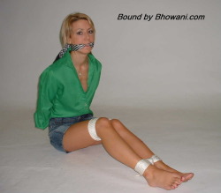 graybandanna:  Sabrina tied up in a green blouse with both a scarf cleave gag and a scarf over the nose gag 