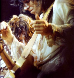 soundsof71:  Mick Jagger peeking from behind Keith Richards, Madison Square Garden 1975.