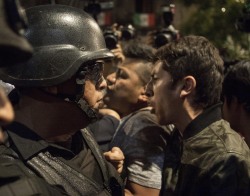 jaimeruizphotography:  A protester confronts the riot police after the protest is stopped from reaching Mexico City’s main square where President Enrique Peña Nieto was participating in the celebrations for Mexican Independence Day today. Olympus OM-D