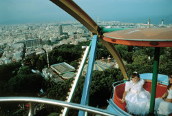20aliens:  SPAIN. Barcelona. 1997After her first communion, a girl visits an amusement park.David Alan Harvey