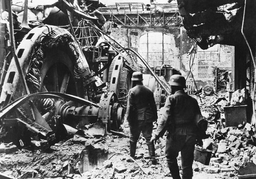 German troops pass through a wrecked generating station in the factory district of Stalingrad, on De