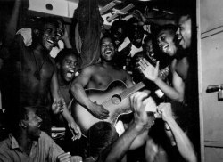 otoso:Enlisted men aboard the U.S.S. Ticonderoga (CV-14) hear the news of Japan’s surrender.  August 14, 1945.   • Lt. B. Gallagher.