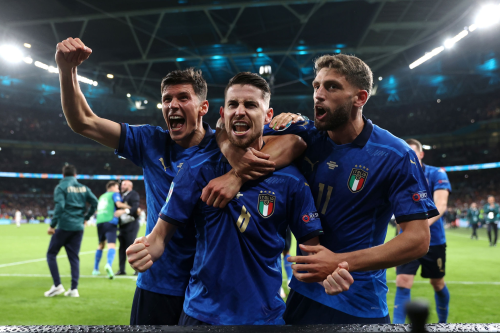 Jorginho celebrates his winning penalty with Matteo Pessina and Domenico Berardi after the match vs.