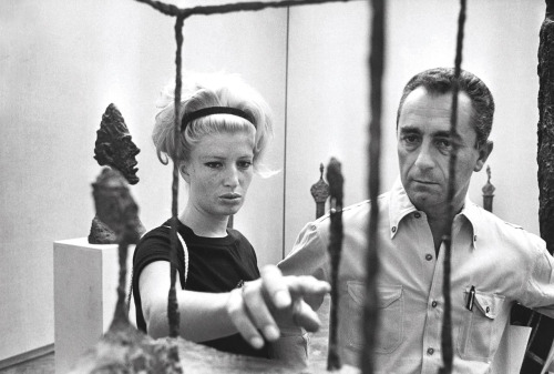 Monica Vitti and Michelangelo Antonioni with a sculpture by Alberto Giacometti at the Venice Biennal