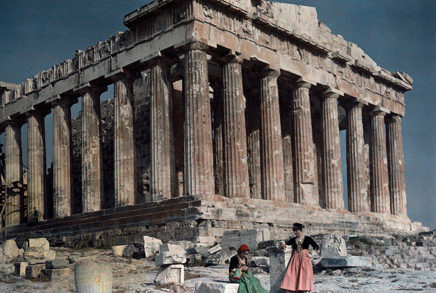 natgeofound:  Women rest at the Parthenon whose damaged structure is under repair,
