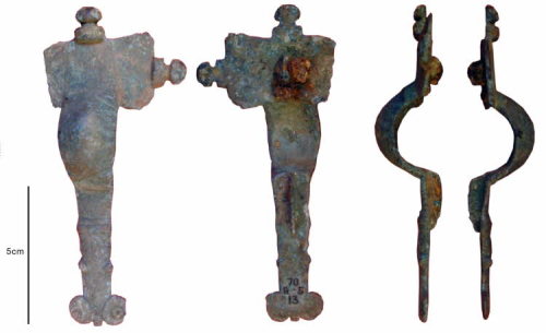 Early Anglo-Saxon cast copper alloy cruciform brooch (c. 475 –550), found in the cemetery sandpit at