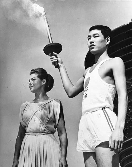 luciledemory:Yoshinori Sakaï and Greek actress Aleka Katseli. Tokyo Olympic Games, 1964. Via th