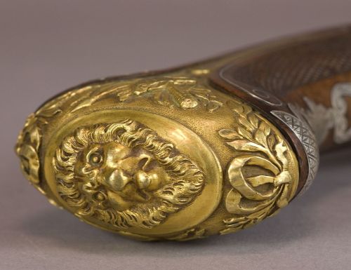 art-of-swords:  Pistol Dagger Dated: circa 1850 Culture: British (manufactured for the Orient) The weapon has round faceted barrels with lugs, gilt engraved and decorated, and marked ‘London’. The swan neck plate and hammer have a flat body, while