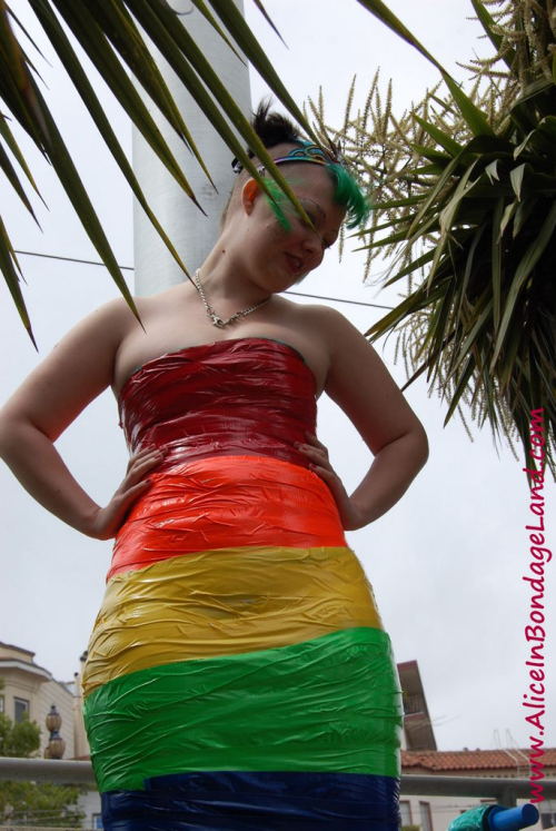 Pride Flag public bondage performance art  with Denali Winter in the Castro neighborhood of San Francisco! This is  as public as it gets - at the corner of Market and Castro. Hundreds of  people watch our kinky performance art.If you missed the show in